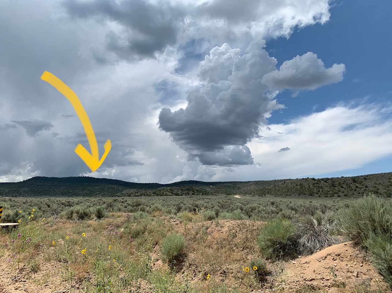 A view of Wild Horse Mesa from the valley! Campsite is near the arrow