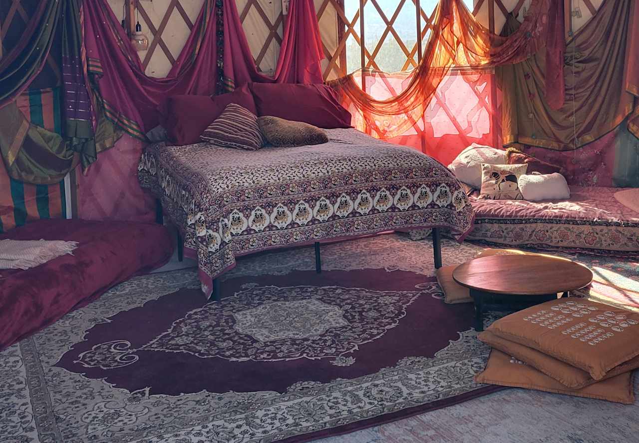 double bed flanked by two of the three lounge cushions, or single beds